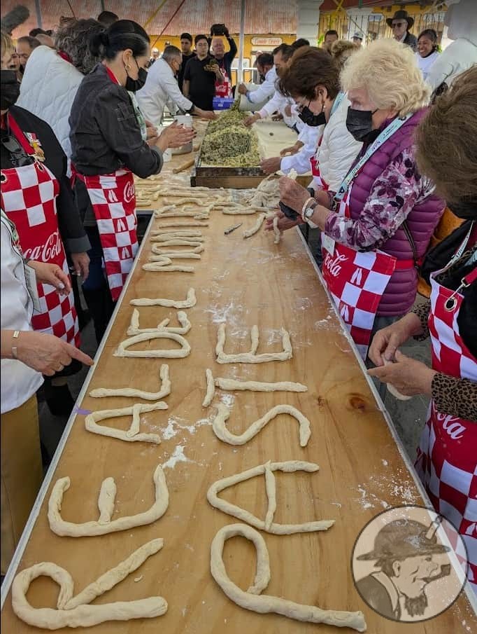 Rolling the dough to spell Real del Monte Paste Festival